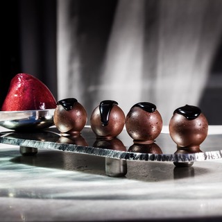 Liquid chocolate balls with blackcurrant sorbet   photofrancesc guillamet