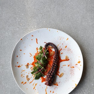 3. grilled octopus with romesco sauce  wild green and toasted almonds
